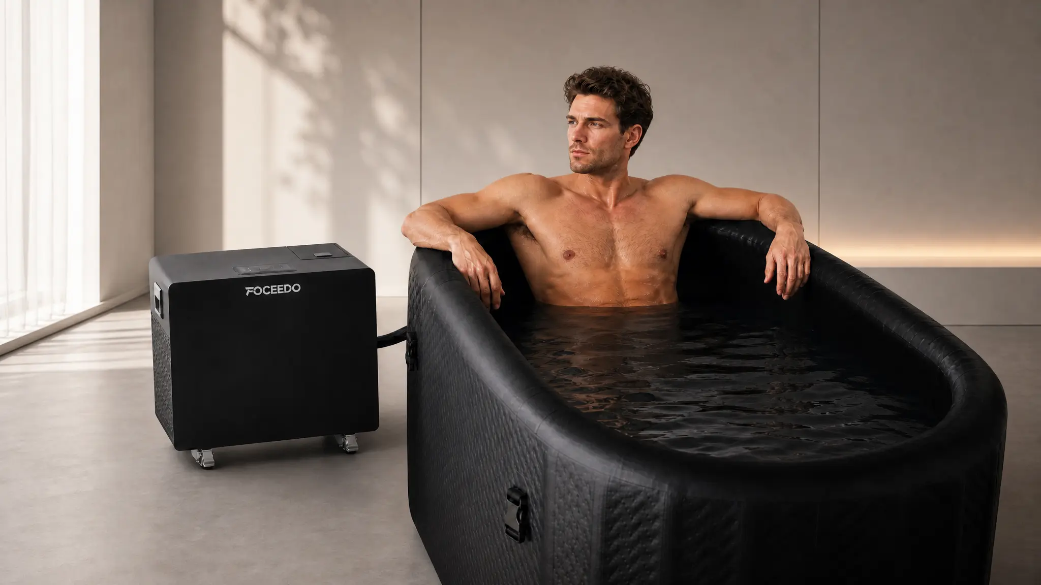 An image of a man relaxes in a portable inflatable cold plunge tub
