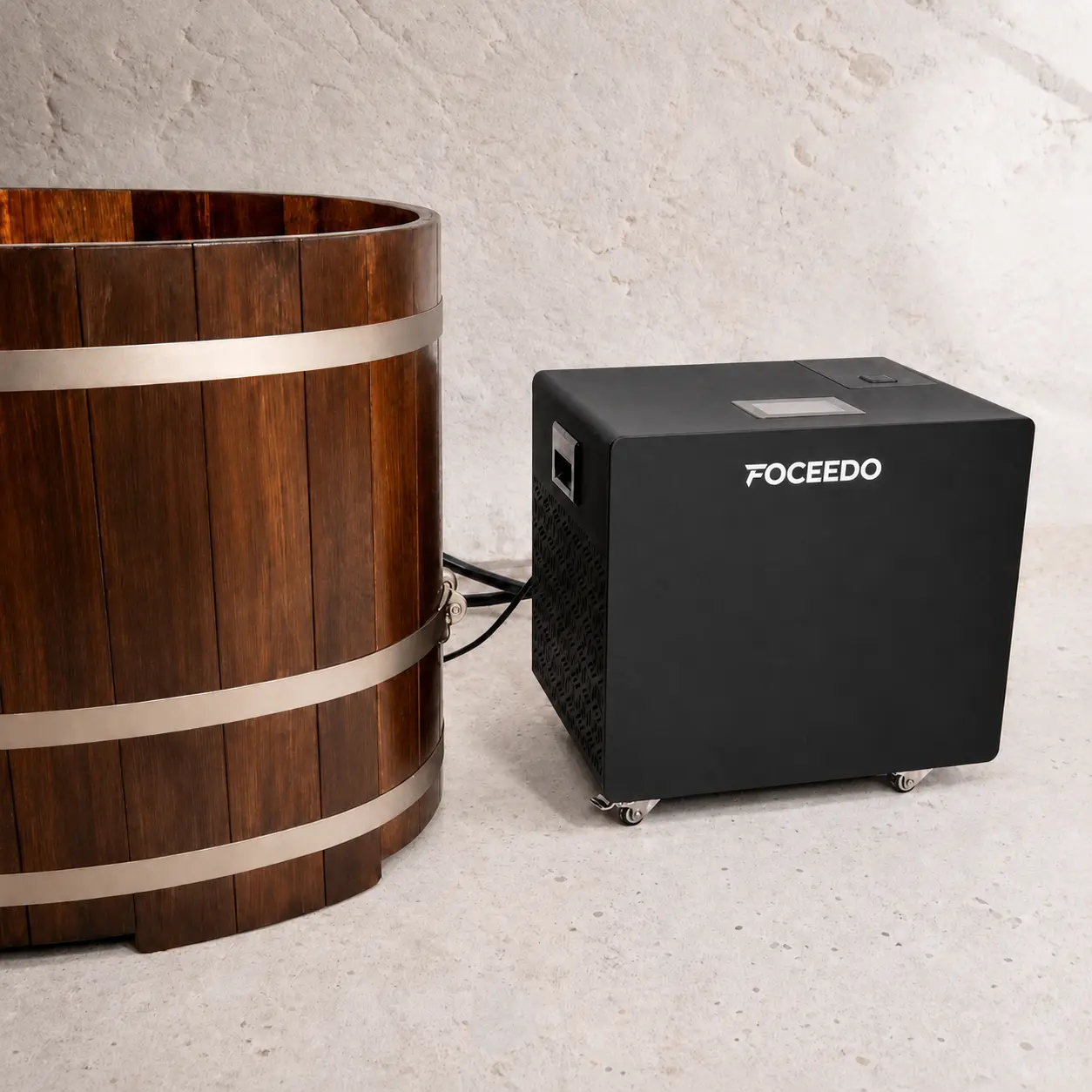 Close-up of a Foceedo ice bath chiller seamlessly connected to a wooden tub, highlighting the simple plug-and-play setup that requires no complex home installation.